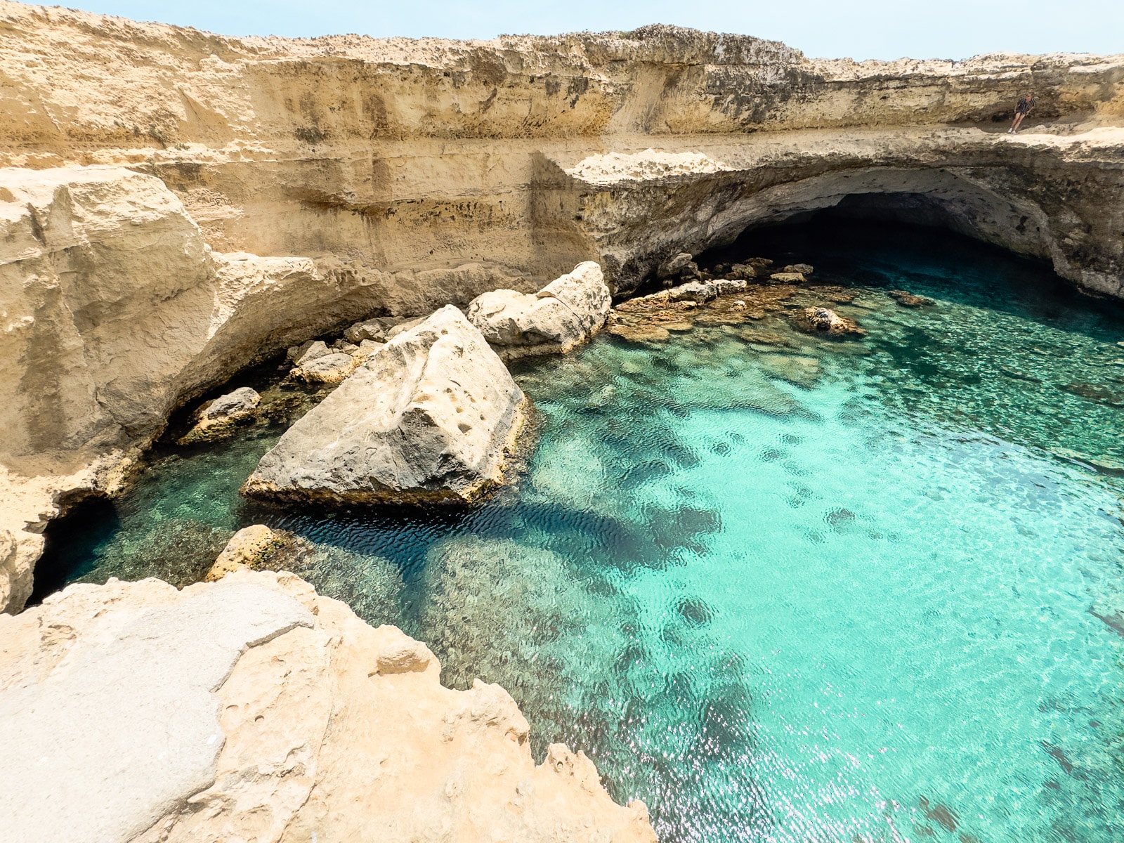 Looking down into the grotto at Grotta della Poesia in Puglia, Italy