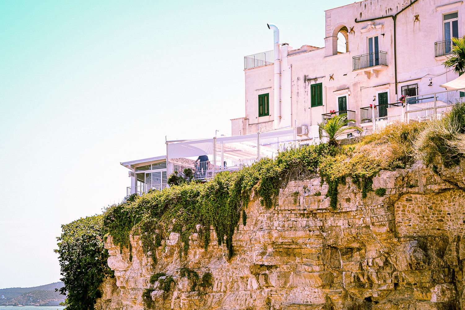 Ultimate Puglia Vacation Guide: Cliffside vista of the coastline in Vieste, Puglia, Italy