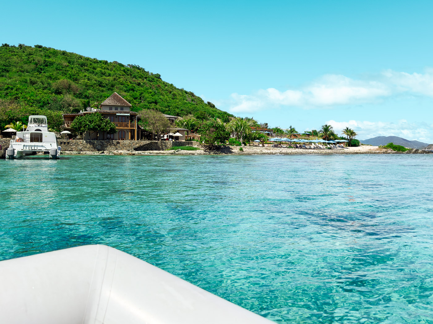 11 Very Best Things to do in St. John: View of Lovango Cay Resort from a dinghy in the water in St. John, USVI 