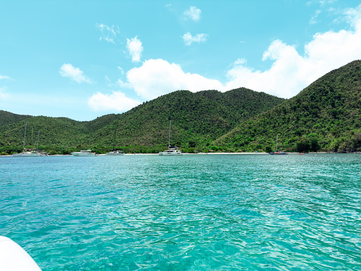 11 Very Best Things to do in St. John: Scenic view of Maho Bay's shoreline on St. John, captured from a dinghy