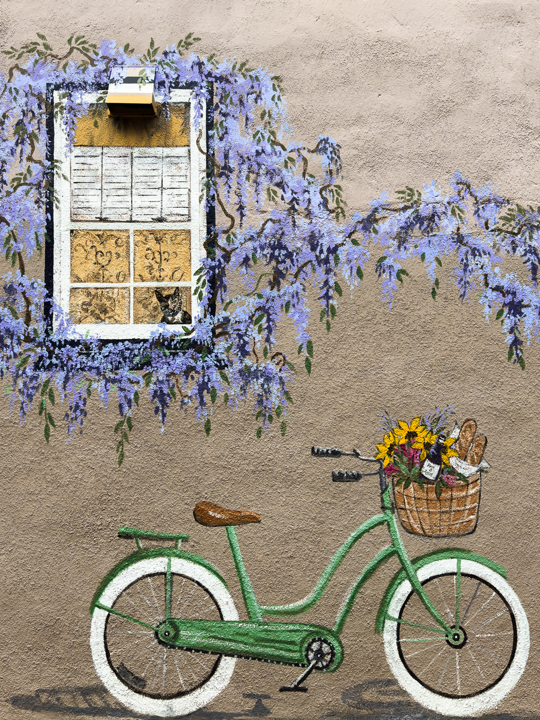 9 Must-Do Activities for the Perfect Weekend in Annapolis, Maryland: Bicycle and Window with Flowers Wall Mural on the side of the street in Downtown Annapolis, Maryland